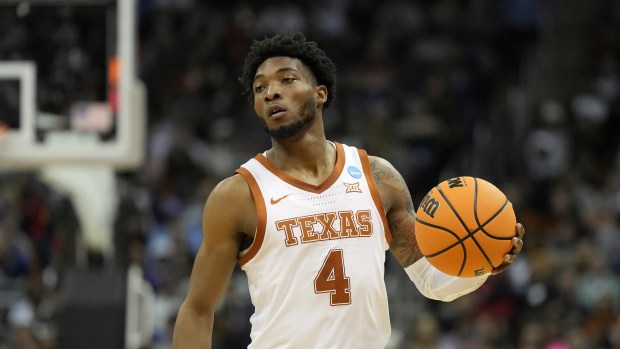 Texas guard Tyrese Hunter brings the ball down court Xavier in the first half of a Sweet 16 game in the Midwest Regional of the NCAA Tournament Friday, March 24, 2023, in Kansas City, Mo.