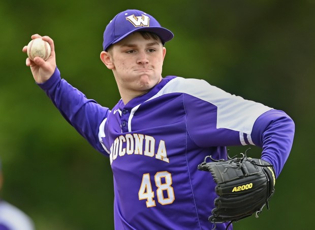 Wauconda pitcher Zach Threde checks a runner 