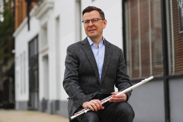 Chicago Symphony Orchestra principal flute Stefán Ragnar Höskuldsson outside his home in Chicago on May 11, 2020. (Jose M. Osorio / Chicago Tribune)