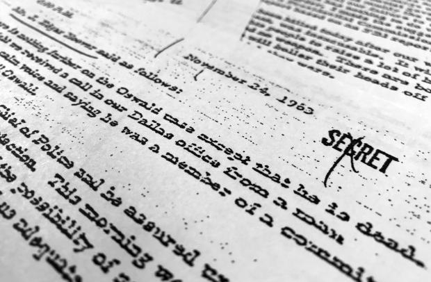 Part of a file, dated Nov. 24, 1963, quoting FBI director J. Edgar Hoover as he talks about the death of Lee Harvey Oswald, is photographed in Washington, Oct. 26, 2017. (AP Photo/Jon Elswick, File)