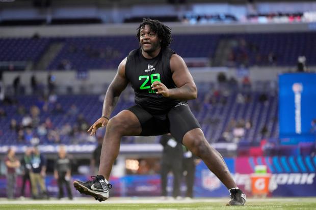 Missouri offensive lineman Armand Membou runs a drill at the NFL combine on March 2, 2025, in Indianapolis. (George Walker IV/AP)