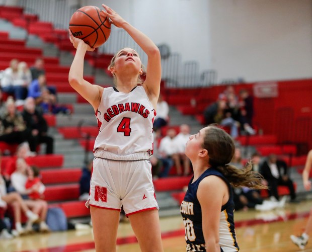 Naperville Central basketball player Callie Tumilty goes for a layup