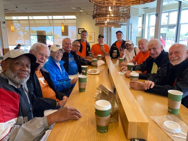 The Tennis Bums pictured at Panera Bread. Founded in 2003, the Tennis Bums are a community tennis group for senior players. Members hail from Naperville and surrounding suburbs. (Richard Hutter)