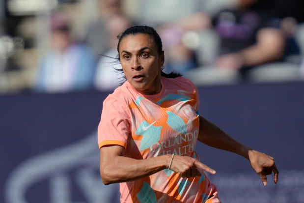 The Orlando Pride's Marta in action against Racing Louisville on March 16, 2024, in Louisville, Ky. (AP Photo/AJ Mast)