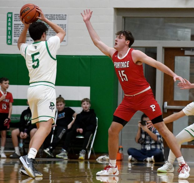 Portage's Michael Wellman guards Valparaiso's Thomas Flynn 