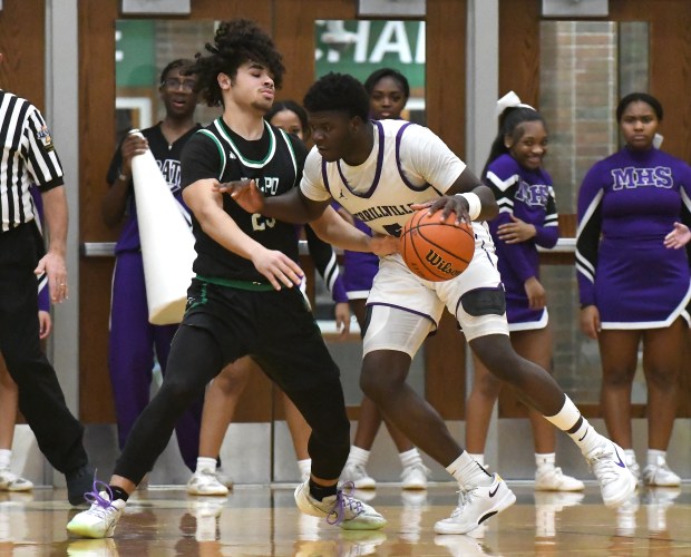 Merrillville's Kelvion Brown works his way to the basket against Valparaiso's Julian Stokes