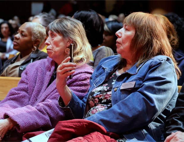 Linda Ashley (right) listens as Gary Mayor Eddie Melton addresses the audience at a special community meeting to learn about the city's proposal to be the site of the proposed Lake County Convention Center at Hard Rock Casino on Thursday, March 6, 2025 (John Smierciak / Post-Tribune)