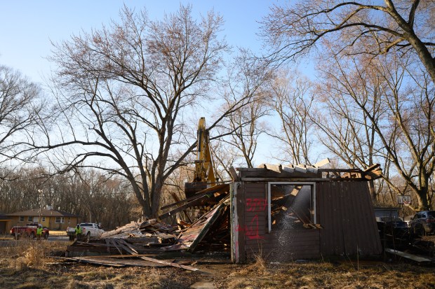 An abandoned building is razed to the ground to celebrate the beginning of another wave of demolitions in Gary's Aetna neighborhood on Monday, March 10, 2025. (Kyle Telechan/for the Post-Tribune)