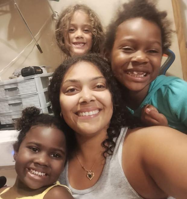 Briana Payne and her daughters, from left, Alayna, Aurorah and Ava, pose in an undated photo. The four were killed by Payne's husband in a murder-suicide. (Photo courtesy by Lili Parker Owens)