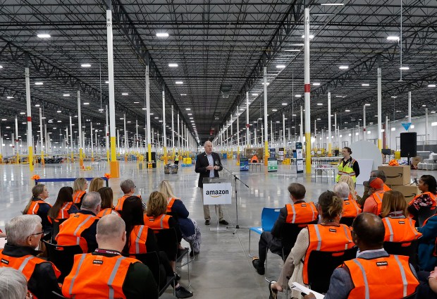 Merrillville Town Councilman Shawn Pettit talks about the amazing cooperation the town has with Amazon during the ribbon-cutting ceremony and tour of the Amazon Fulfillment Center in Merrillville on Wednesday, March 19, 2025. The event showcased Amazon's latest investment, featuring advanced technology that processes hundreds of thousands of packages daily. (John Smierciak / for the Post-Tribune)