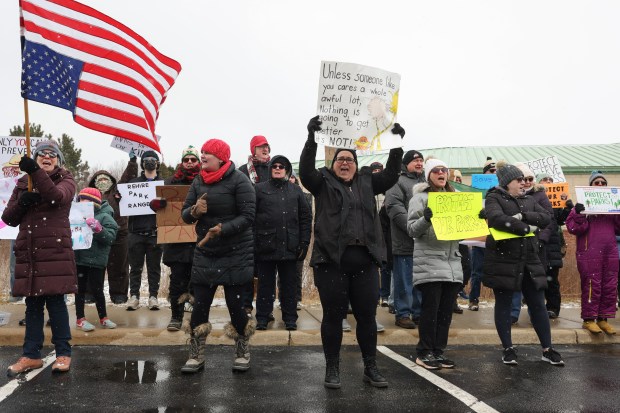 Demonstrators rally to protest ongoing National Park Service cuts outside the Indiana Dunes Visitor Center Saturday, March 1, 2025, in Porter, Indiana. (John J. Kim/Chicago Tribune)