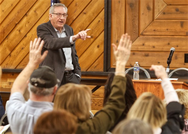 Indiana State Rep. Hal Slager, R-Schererville, points out a person to ask a question during a town hall meeting to share updates on the 2025 Indiana legislative session and discuss community concerns at the St. John Township Community Center in Schererville on Saturday, March 15, 2025. (John Smierciak / for the Post-Tribune)