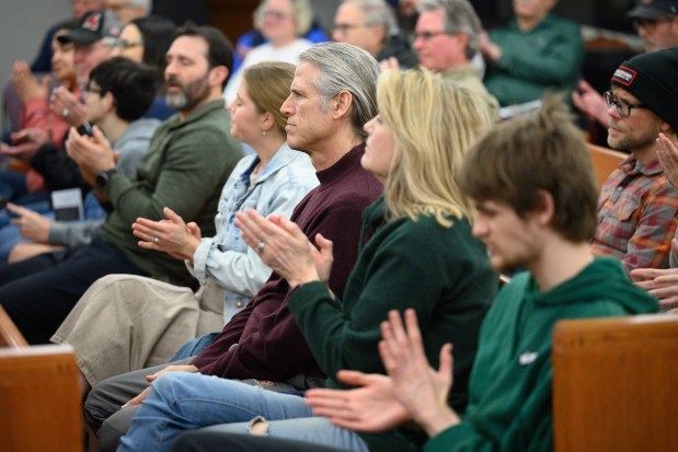 Audience members applaud after a debate team makes their case during a Valparaiso Chain of Lakes Watershed Group-sponsored debate on Monday, March 17, 2025. (Kyle Telechan/for the Post-Tribune)