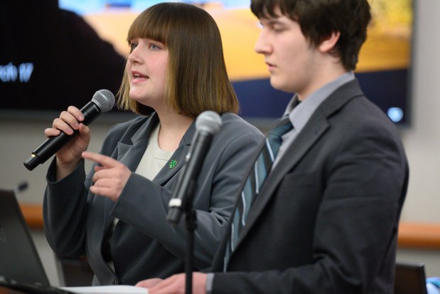 Valparaiso debate team member Lottie Wells, on left, makes her case against Chesterton debate team member Patrick Hansen during an environmental debate sponsored by the Chain of Lakes Watershed Group at the Porter County Government Center on Monday, March 17, 2025. (Kyle Telechan/for the Post-Tribune)