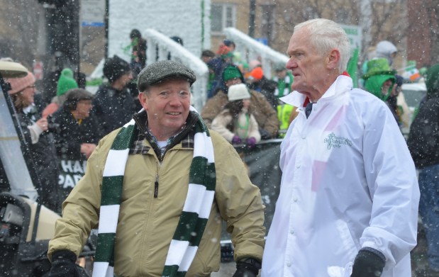 Kevin Coakley, left, and Bill Letz walk the parade route March 16, 2025. Coakley marched in the first South Side Irish Parade when he was 7. (Jeff Vorva/for the Daily Southtown)