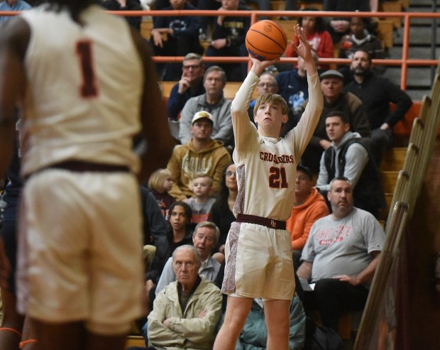 Brother Rice's Caden Workman (21) puts up a three point attempt against Hillcrest during the Class 3A Brother Rice Sectional semifinals Tuesday, March 4, 2025 in Chicago, IL. (Steve Johnston/for the Daily Southtown)