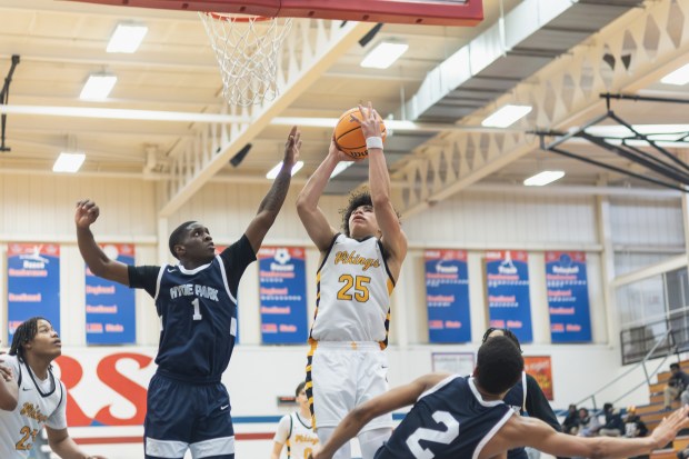 St. Laurence's Jacob Rice (25) goes up for a layup against Hyde Park during a Class 3A Glenbard South Sectional semifinal game in Glen Ellyn on Tuesday March 4, 2025. (Troy Stolt for the Daily Southtown)