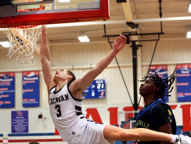 Mount Carmel's Grant Best shoots two during the Class 3A Glenbard South Sectional semifinals boys basketball game against De La Salle in Glen Ellyn on Wednesday, March 5, 2025. (James C. Svehla / for the Daily Southtown)