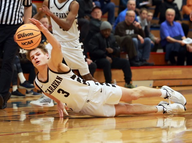 Mount Carmel's Grant Best dives for the ball during the Class 3A Glenbard South Sectional semifinals boys basketball game against De La Salle in Glen Ellyn on Wednesday, March 5, 2025. (James C. Svehla / for the Daily Southtown)