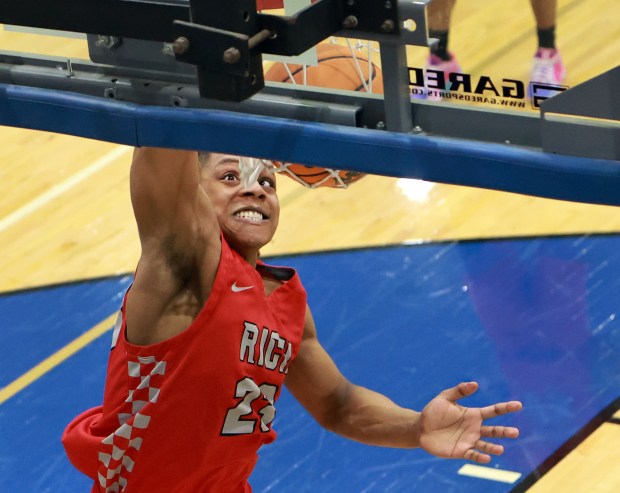 Rich Township's Nyshawn Turner slams the ball during the Class 4A Lincoln-Way East Regional final boys basketball game against Lincoln-Way East in Frankfort on Friday Feb. 28, 2025. (James C. Svehla / for the Daily Southtown)