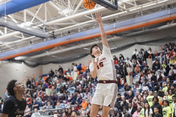 Brother Rice's Max Justic (15) goes up for a layup against Peoria during the Class 3A Pontiac Supersectional game on Monday March 10, 2025. (Troy Stolt for the Daily Southtown)