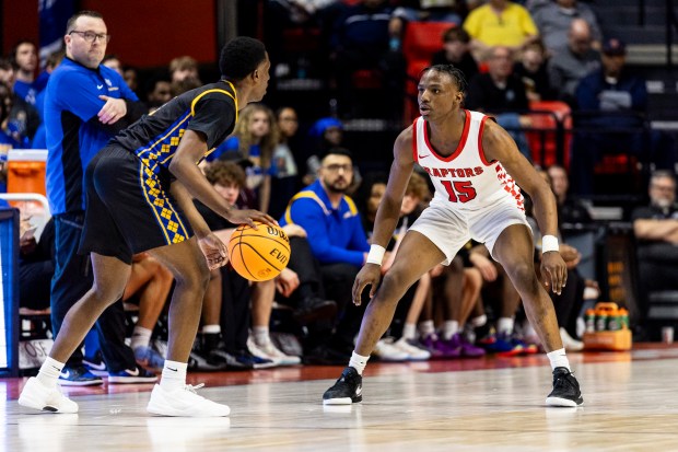 Rich Township's Troy Garner (15) guards Warren Township's Jaxson Davis (1) during the Class 4A state semifinal at State Farm Center in Champaign on Friday, March 14, 2025. (Vincent D. Johnson / for the Daily Southtown)