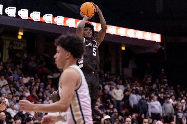 Mount Carmel's Cameron Thomas (5) puts up a three pointer against St. Patrick during the Class 3A Illinois-Chicago Supersectional at Credit Union 1 Arena in Chicago on Monday, March 10, 2025. (Vincent D. Johnson / for the Daily Southtown)