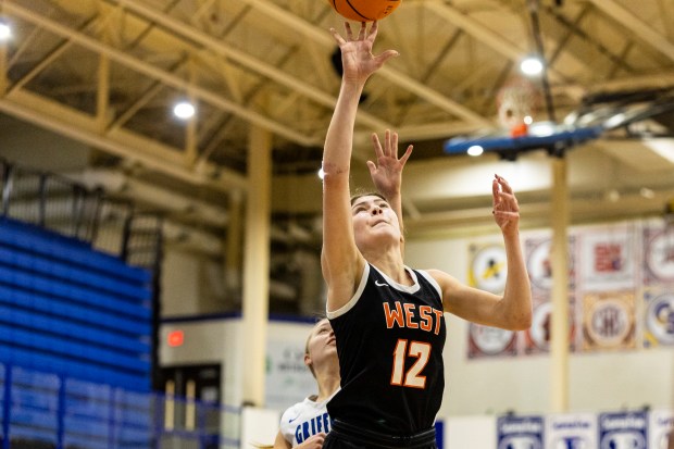 Lincoln-Way West's Caroline Smith (12) puts up a ashot against Lincoln-Way East during a Southwest Suburban Conference game in Frankfort on Tuesday, Jan. 7, 2025. (Vincent D. Johnson / for the Daily Southtown)