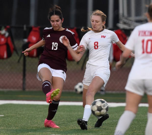 Argo's Leslie Rodriguez (19) and Homewood-Flossmoor's Lilia Abramczyk (8) battle for the ball during the Windy City Ram Classic Tuesday, March 18, 2025 in Summit, IL. (Steve Johnston/for the Daily Southtown)