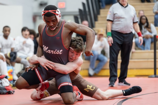 Mount Carmel's Seth Mendoza wrestles against Marist's Donavon Allen in a 150 pound match during the Class 3A Yorkville Dual Team Sectional in Yorkville on Tuesday, Feb. 25, 2025. (Troy Stolt / for the Daily Southtown)
