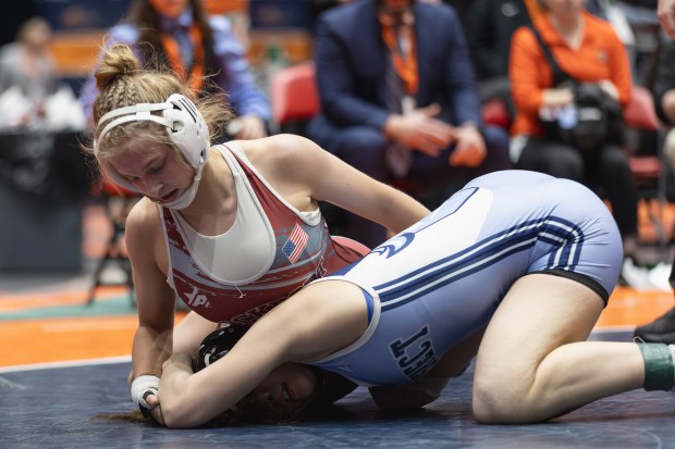 Lockport's Claudia Heaney wrestles Prospect's Viola Pianetto during the 135 pound championship match of the IHSA girls wrestling individual state meet on in Bloomington on Saturday, March 1, 2025. (Troy Stolt / for the Pioneer Press)