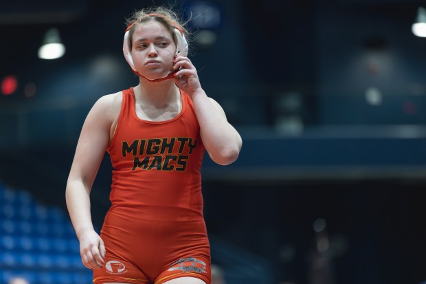 Mother McAuley's Maggie Zuber walks off the Matt after being defeated in the 135 pound championship match of the IHSA girls wrestling individual state meet on in Bloomington on Saturday, March 1, 2025. (Troy Stolt / for the Pioneer Press)