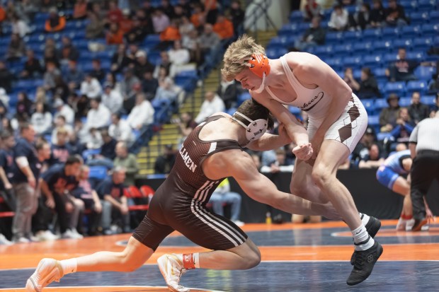 Joliet Catholic's Nicholas Ronchetti wrestles Hersey's John Slump during their 190 pound match in the IHSA 3A wrestling state dual tournament in Bloomington on Saturday, March 1, 2025. (Troy Stolt / for the Daily Southtown)