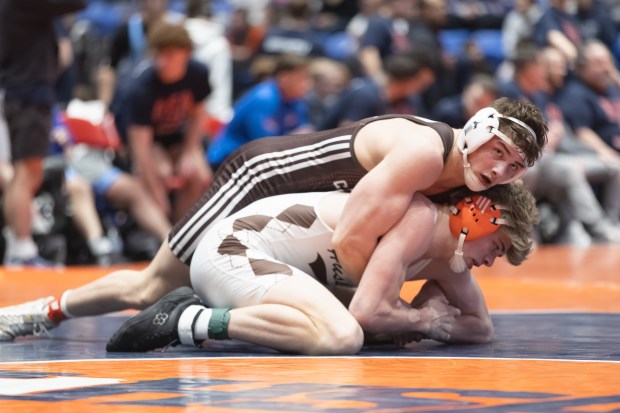 Joliet Catholic's Nicholas Ronchetti wrestles Hersey's John Slump during their 190 pound match in the IHSA 3A wrestling state dual tournament in Bloomington on Saturday, March 1, 2025. (Troy Stolt / for the Daily Southtown)