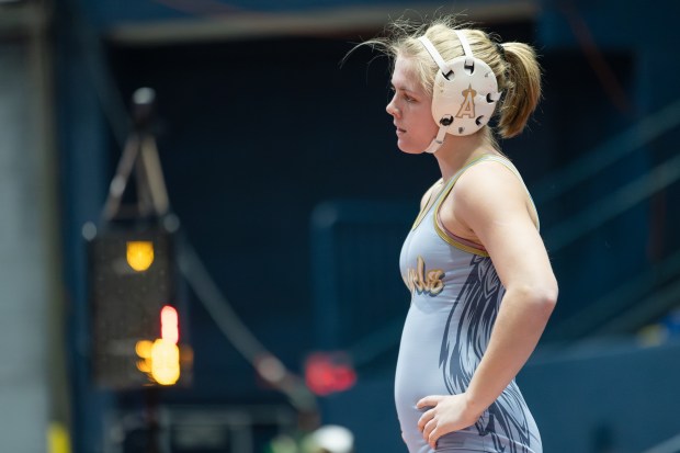 Joliet Catholic's Grace Laird wrestles Lane's Nyah Lovis during the 130 pound third place match of the IHSA girls wrestling individual state meet on in Bloomington on Saturday, March 1, 2025. (Troy Stolt / for the Daily Southtown)