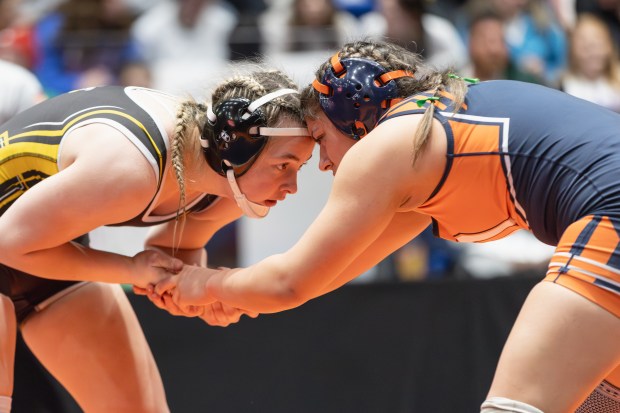 Hinsdale South's Callie Carr wrestles Oswego's Kiyah Chavez during the 155 pound championship match of the IHSA girls wrestling individual state meet on in Bloomington on Saturday, March 1, 2025. (Troy Stolt / for the Pioneer Press)