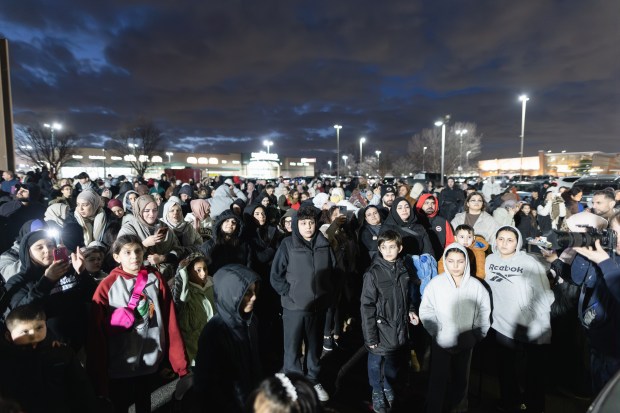 Members of Bridgeview's Muslim community gather at Al Manarah Square to celebrate the Bridgeview installing Ramadan and Eid lights on Harlem Avenue Feb. 28, 2025. (Troy Stolt/for the Daily Southtown)