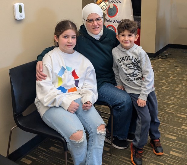 Safa Salamah and her two children, Jorie and Jad, attend the Ramadan story hour Feb. 28, 2025, at the Palos Heights Public Library. (Janice Neumann/for the Daily Southtown)