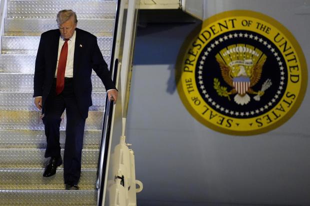 President Donald Trump arrives on Air Force One at Palm Beach International Airport, Friday, March 14, 2025, in West Palm Beach, Fla. (AP Photo/Manuel Balce Ceneta)