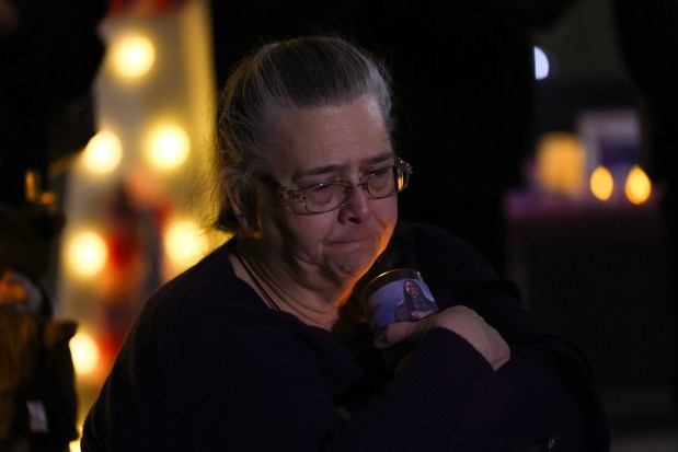 Lili Parker Owens listens to speakers during a gathering in memory of her daughter, Briana Payne, and grandchildren, Alayna, Ava and Aurorah, at Bailey Elementary School Friday, Feb. 28, 2025, in Lake Station, Indiana. Briana Payne and her children were fatally shot by Robert Payne, the husband and father of the family, on Feb. 21, in a murder-suicide, according to police. (John J. Kim/Chicago Tribune)