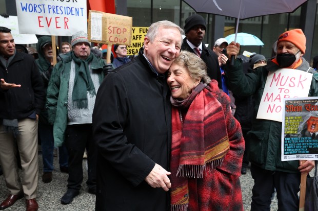 U.S. Sen. Dick Durbin hugs U.S. Rep. Jan Schakowsky  after speaking to researchers and scientists gathered at Federal Plaza in Chicago on March 7, 2025, to protest federal funding cuts. (Terrence Antonio James/Chicago Tribune)