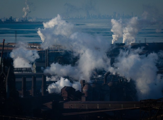 Chicago skyline is seen in the background as U.S. Steel Gary Works on Lake Michigan operates in Gary on Jan. 23, 2025. (E. Jason Wambsgans/Chicago Tribune)