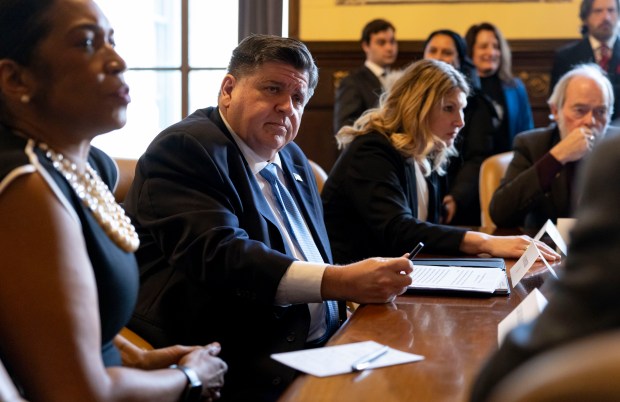 Gov. JB Pritzker hosts a roundtable on prescription benefits from his ceremonial office after delivering his annual budget address on Feb. 19, 2025, at the Illinois State Capitol in Springfield. (Brian Cassella/Chicago Tribune)