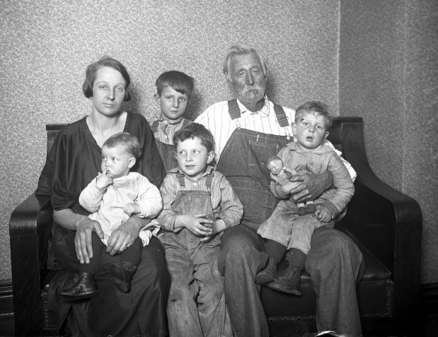 Mrs. Barnett and her children Albert, 6, Blanche, 1, Garrett, 5, and Ralph Barnett, 3, along with their grandfather Mr. Jacobs, 86, are the first refugee family to arrive in Chicago from Murphysboro, Illinois, after the Tri-State Tornado hit the town on March 18, 1925. (Chicago Herald and Examiner) 