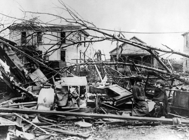 Minnie, left, and Rose Hawkins sit amongst the wreckage of their home in Murphysboro, Illinois, in the wake of the Tri-State Tornado, March 1925. The tornado began in Missouri on the 18th or March, and tore through Illinois and Indiana, killing almost 700 people. (Topical Press Agency/Hulton Archive)