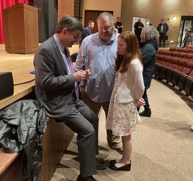 Adam Mulvey, center, and his daughter, Olivia, talk to U.S. Rep. Brad Schneider, D-Highland Park. (Steve Sadin/For the Lake County News-Sun)