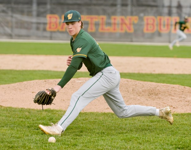 Waubonsie Valley Owen Roberts (2) scoops up the bunt for the out at first against Batavia on Thursday, April 10, 2025. (Mark Black / for the Beacon-News)