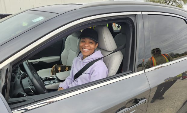 Chenise Creggett of Aurora brought an old TV and some phones on Saturday to the city of Aurora's electronics recycling event. (David Sharos / For The Beacon-News)