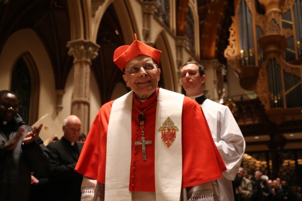Cardinal Francis George processes into Holy Name Cathedral for the first ritual of Blase Cupich's installation as Chicago's next archbishop on Nov. 17, 2014. Cupich knocked on the front doors of Holy Name Cathedral where Cardinal George, auxiliary bishops and other civic and religious leaders greeted him. (Brian Cassella/Chicago Tribune)