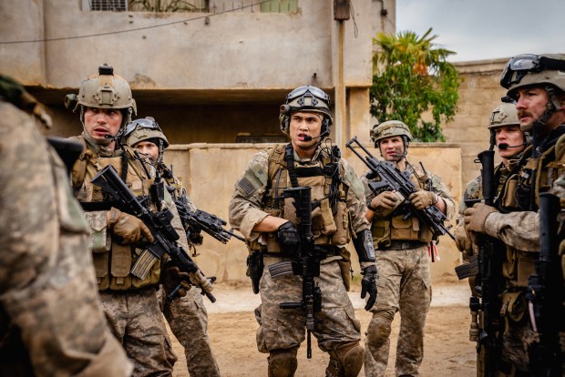 Charles Melton (center) co-stars in "Warfare," based on co-writer and co-director Ray Mendoza's Iraq War experience as a U.S. Navy SEAL. (A24)